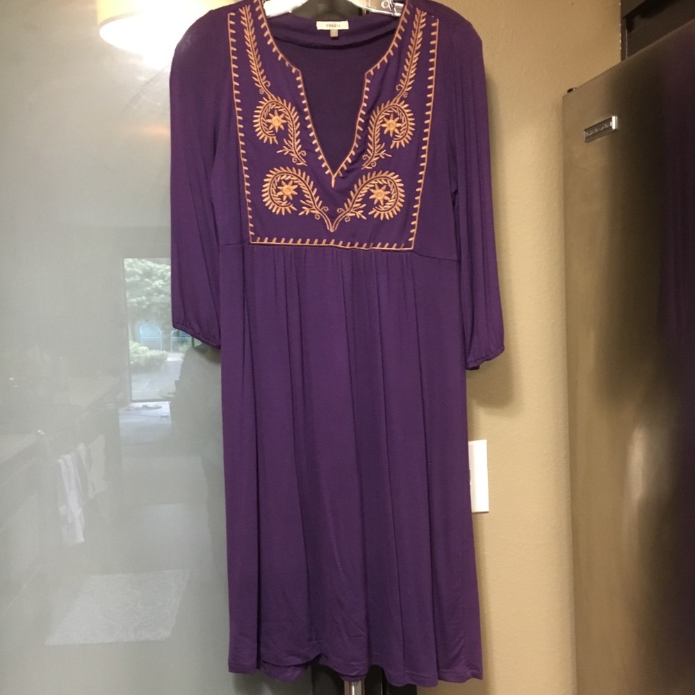 Fossil dress with embroidery on the front.